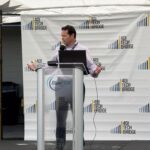 LeVanta Tech CEO Kelly A. Echols speaking at a podium during the BlueTIDE 2025 event, with 401 Tech Bridge branding in the background.