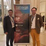 LeVanta Tech representatives standing beside a Tectonic European Defense Summit banner at the conference venue in Paris.